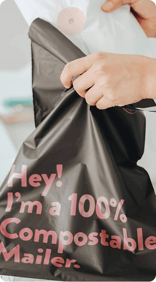 Man holding compostable mailer, representing eco-friendly packaging and sustainable shipping choices.